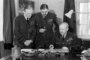 Air Marshal Arthur Harris pictured with his staff at HQ Bomber Command, High Wycombe, on 15 May 1942 shortly after taking up the position of Commander-in-Chief. Left to right: Air Commodore C Graham, Air Vice-Marshal RHMS Saundby and Harris © Crown Copyright