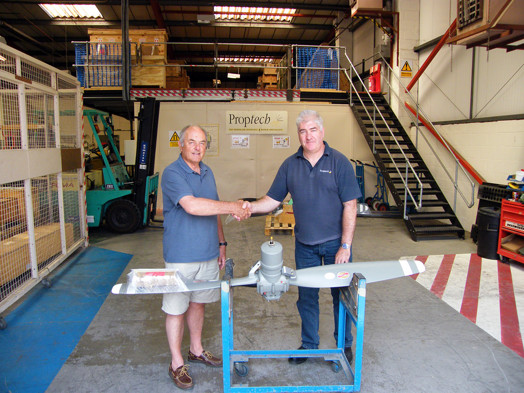 Proptech’s Customer Support Engineer, Alistair Mant, (right) hands over the first exhibition standard propeller to BNAPS’s Bob Wealthy, July, 2013. © Bob Wealthy Collection